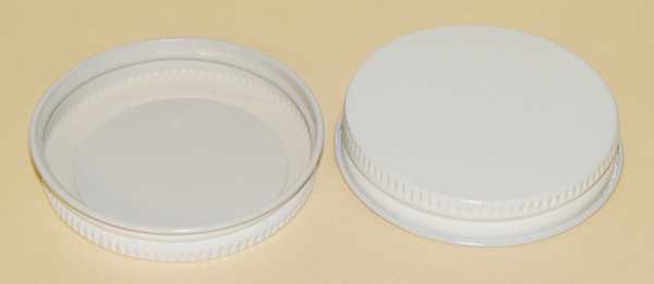 38-400 CLEAR THREADS, KNURLS, & CURL TIN-PLATE STEEL TIN-PLATE STEEL CONTINUOUS THREAD (CT) CAP WITH PLASTISOL LINER